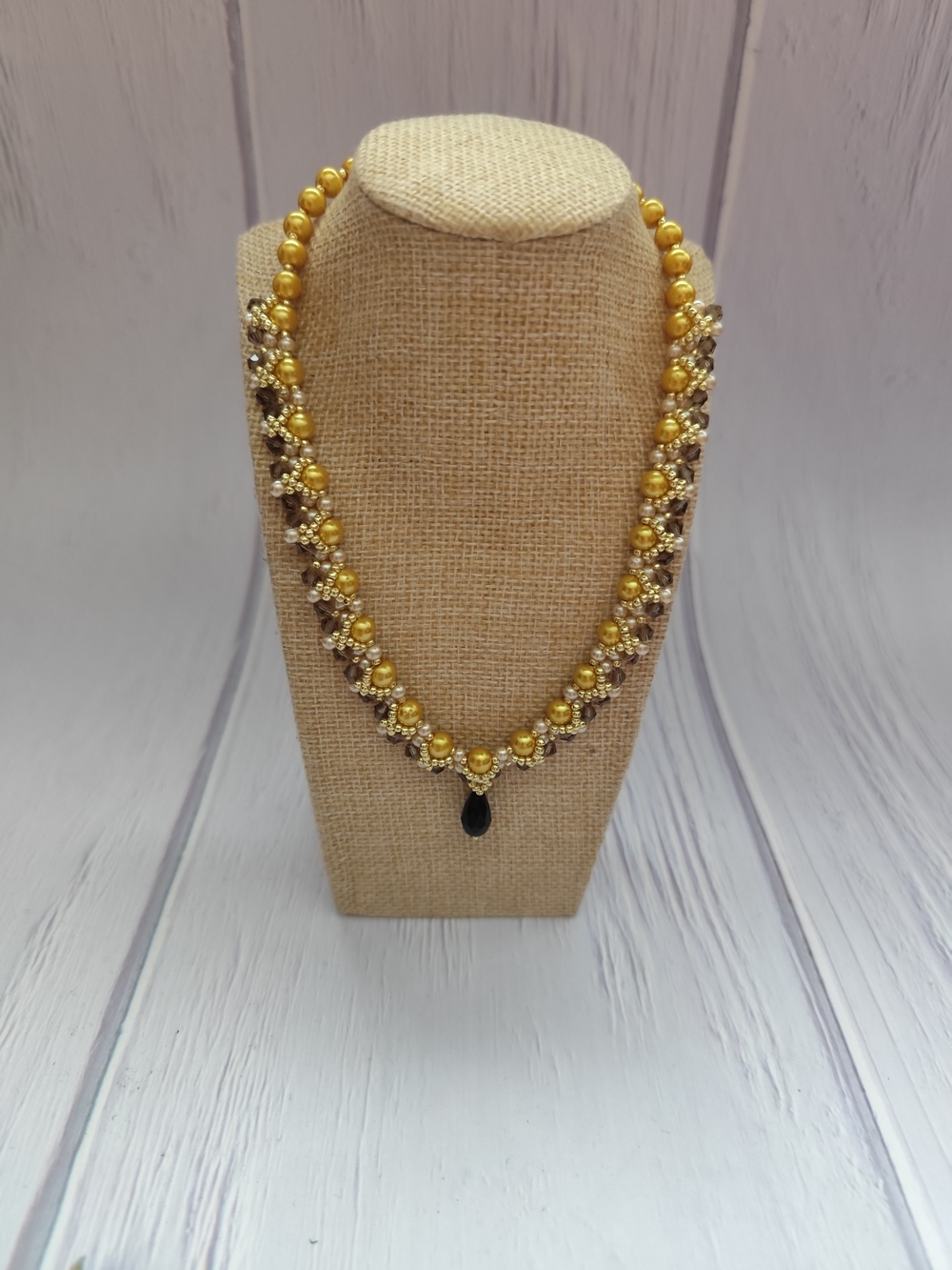 Gold Beaded Women's Necklace with Black Teardrop Pendant